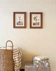 Two antique framed lemon prints hanging on a wall, with a handmade aubergine frame and triple mounting in chocolate brown, antique white, and dawn pink.