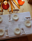 Elegant white cotton napkin 50x50cm inspired by alpine living, perfect for après-ski dining.