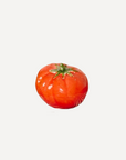 Handmade ceramic red tomato with glossy glaze – artisan stoneware fruit decor crafted in Spain for kitchen or shelf display.