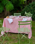 Hand-stitched orange gingham tablecloth with patchwork design on a dining table