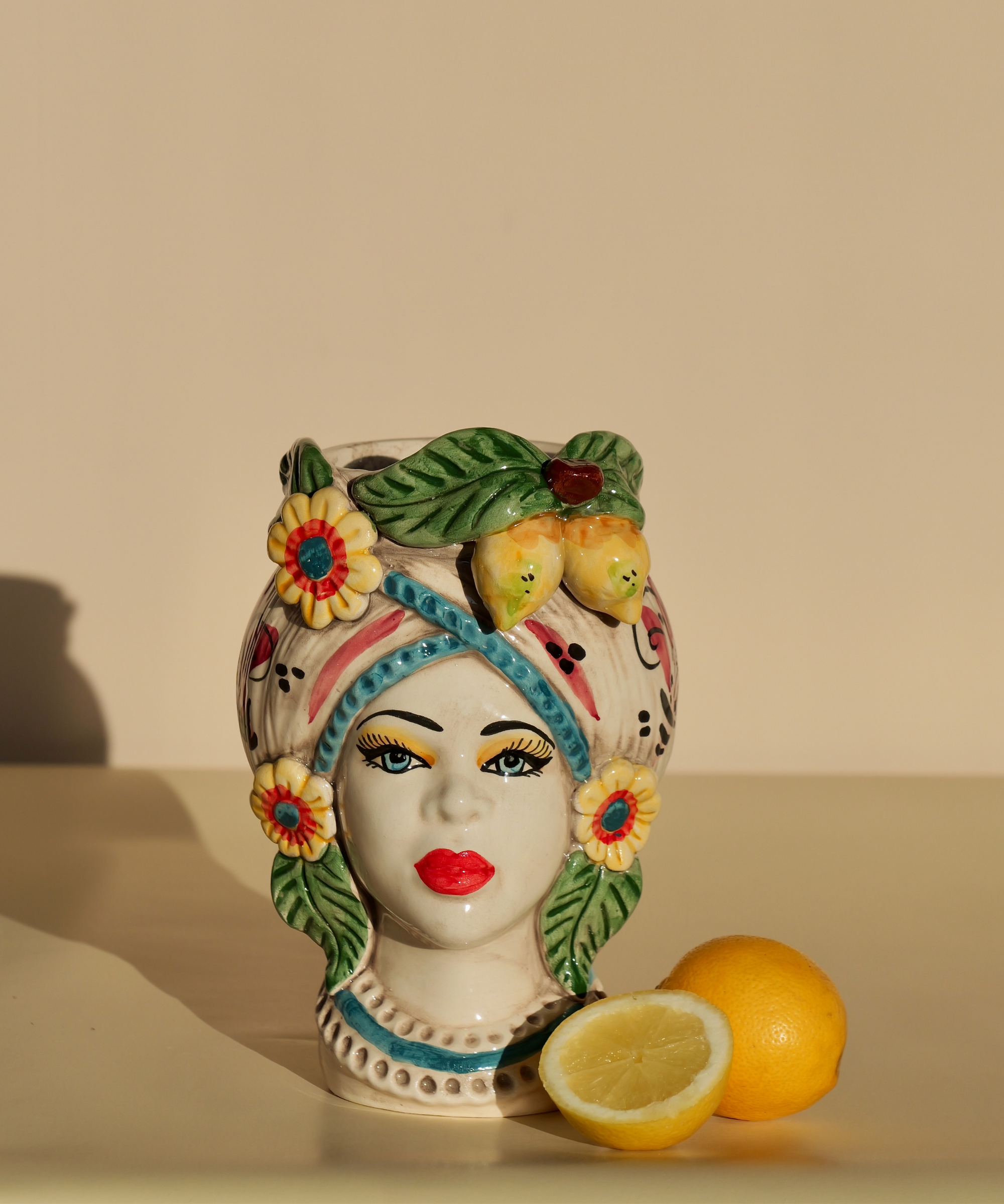 Handmade Sicilian female head vase with lemon and flower crown – ceramic Testa di Moro with Mediterranean detailing.