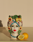 Handmade Sicilian female head vase with lemon and flower crown – ceramic Testa di Moro with Mediterranean detailing.