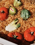 Handmade ceramic red tomato with glossy glaze – artisan stoneware fruit decor crafted in Spain for kitchen or shelf display.