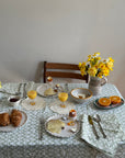 Tablescape using green wiggle pattern linen tablecloth Marla Primrose