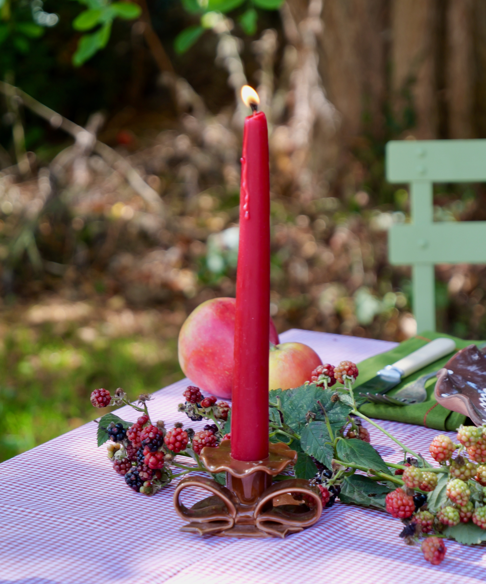 Artisan-made ceramic bow candle holder in brown