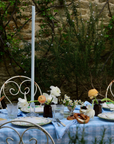 Blue alpine chalet napkin with heart and floral motifs, crafted in Italy from Oeko-Tex certified cotton.