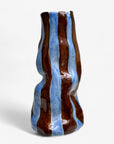 Vase with wavy design in brown and blue on a white background