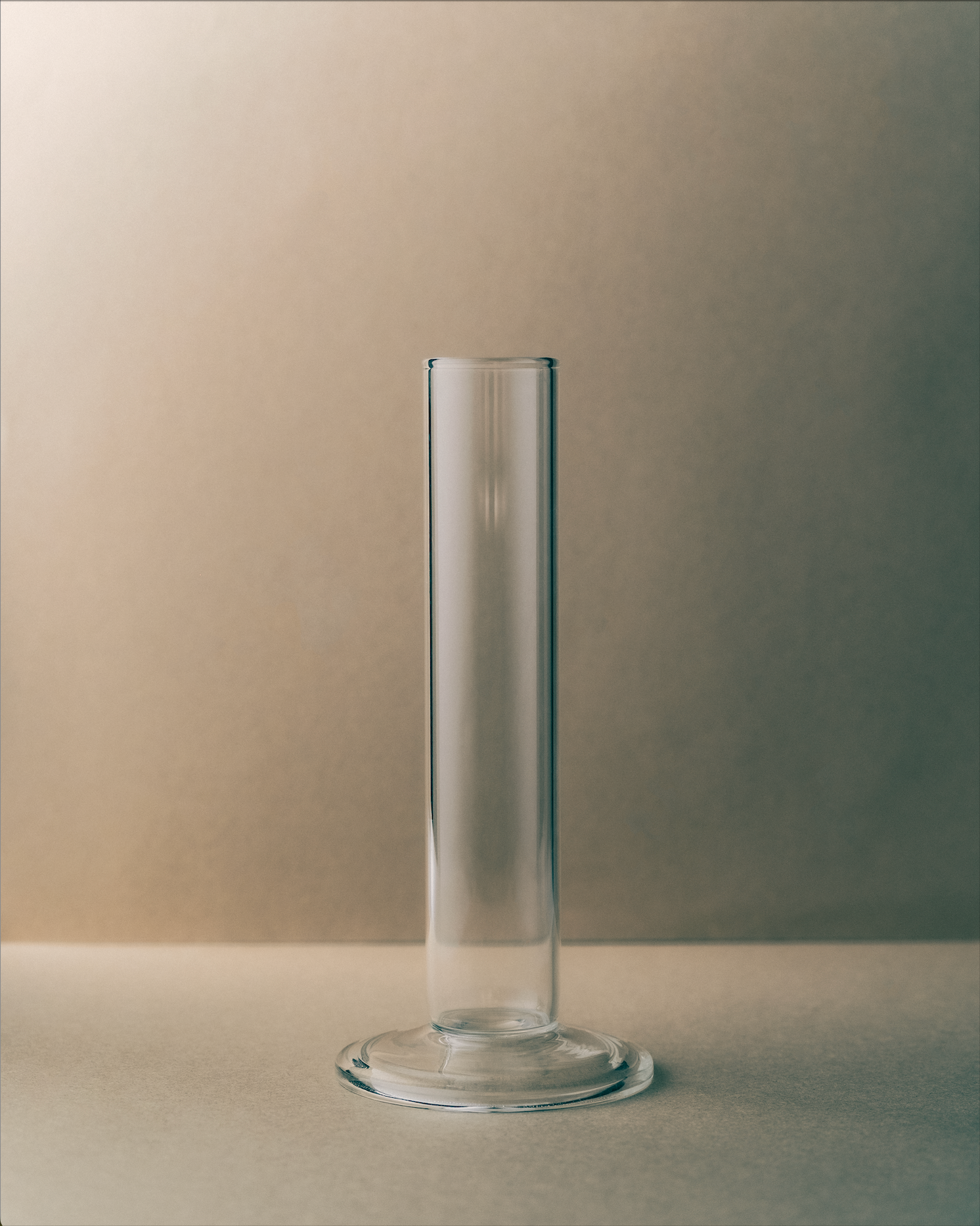 Clear glass vase on a neutral background