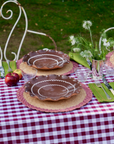 Handmade raffia scallop placemat in lilac, 15-inch round design by Marla Primrose.