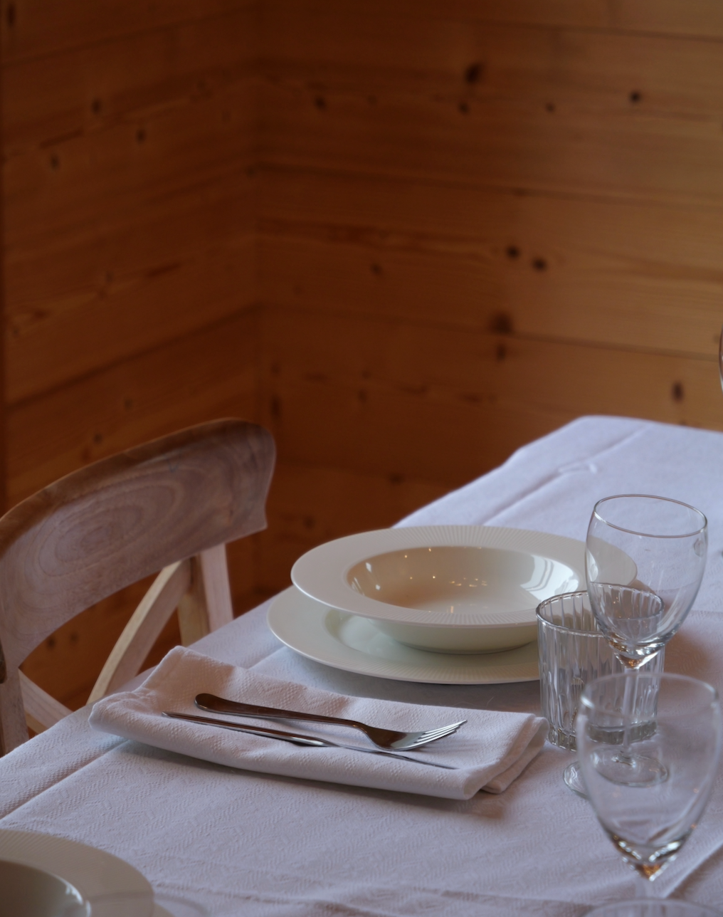 Italian-made white gingham napkin with alpine motifs, designed for mountain chalet style tablescapes.