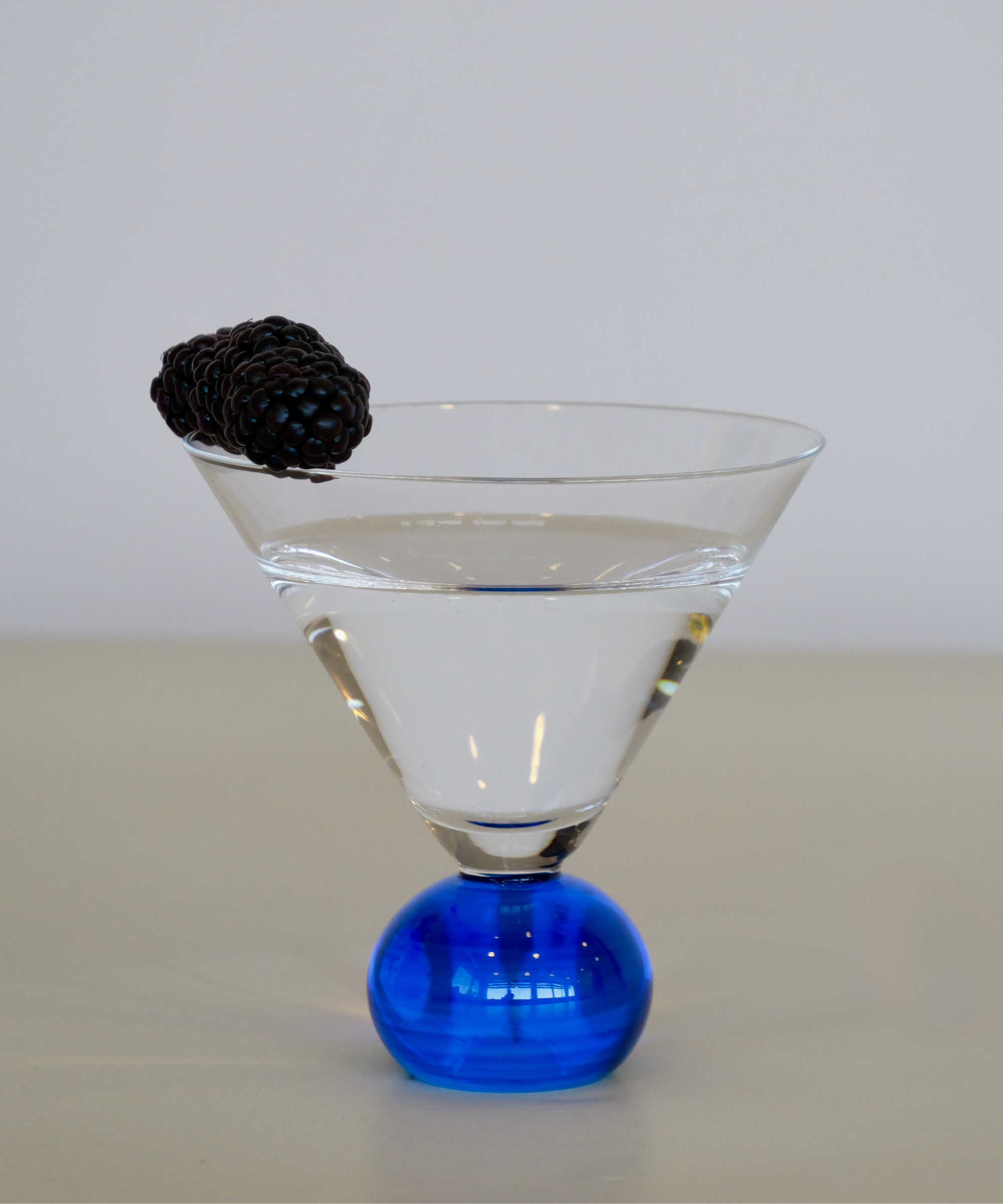 Set of two handcrafted cocktail glasses with blue bobble stems, ideal for martinis and aperitifs – elegant barware from Marla Primrose.