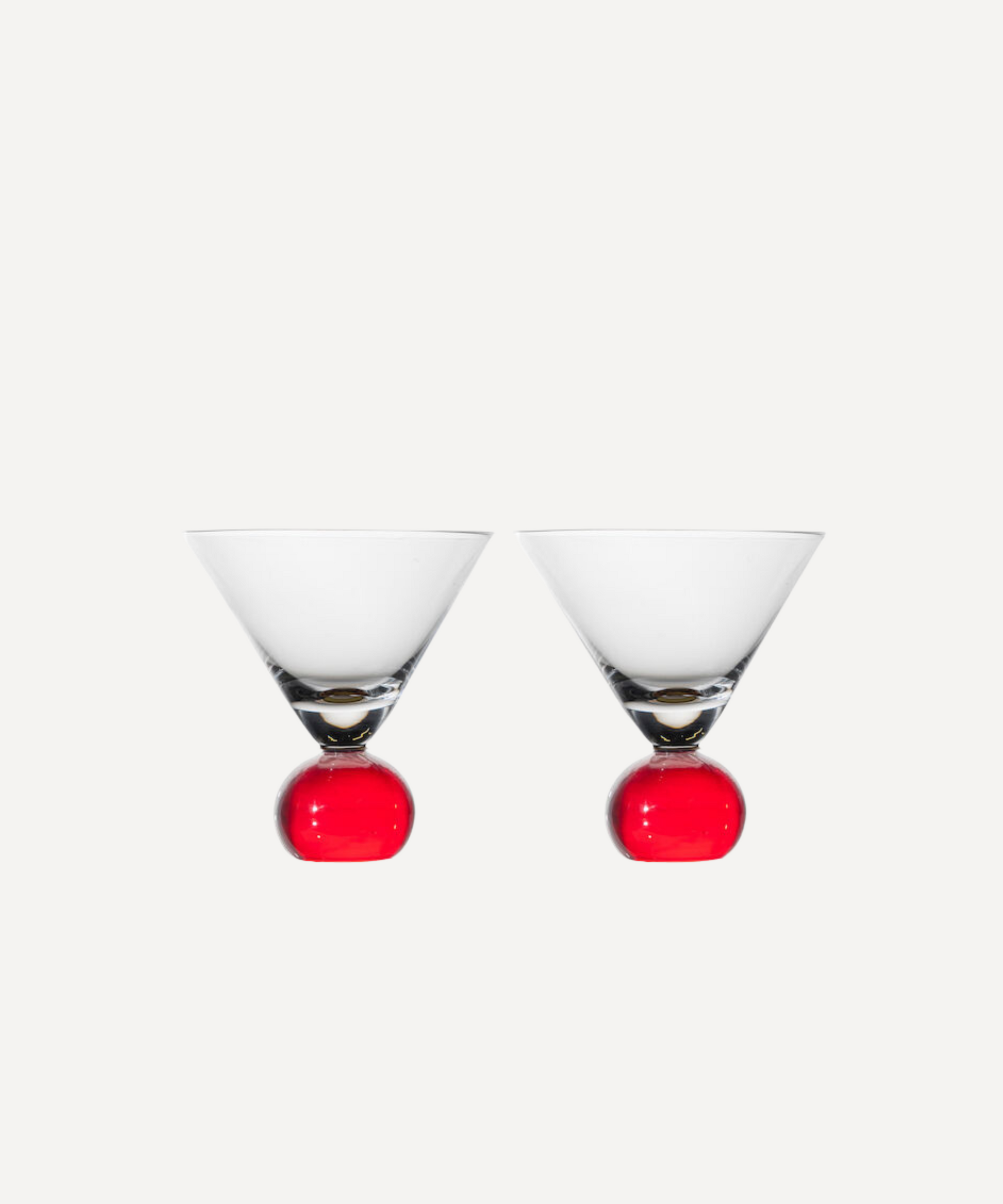 Set of two handcrafted cocktail glasses with red bobble stems, ideal for martinis and aperitifs – elegant barware from Marla Primrose.