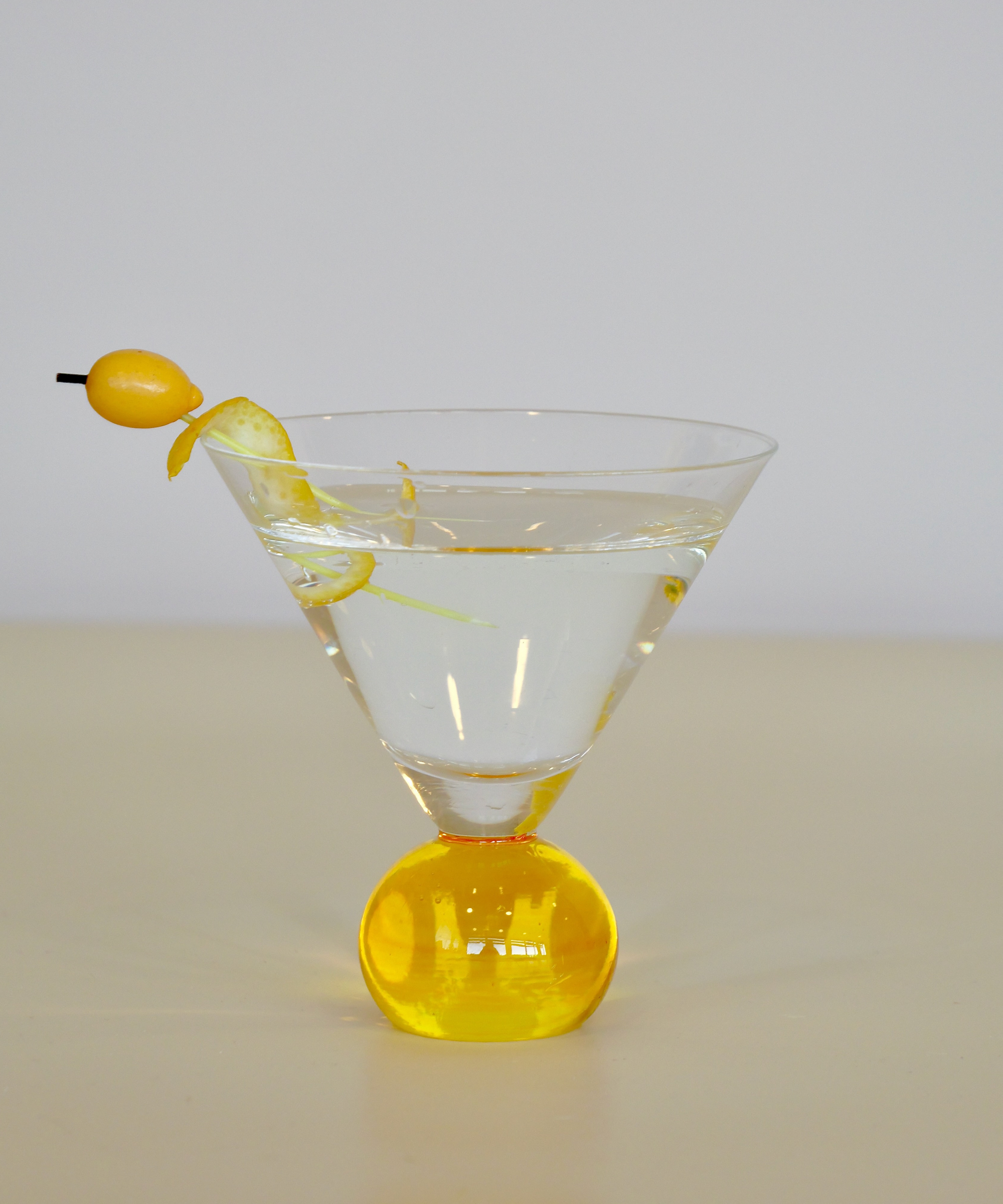 Set of two handcrafted cocktail glasses with yellow bobble stems, ideal for martinis and aperitifs – elegant barware from Marla Primrose.