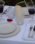 White alpine chalet napkin with subtle heart and floral motifs, crafted in Italy from Oeko-Tex certified cotton.
