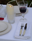 Elegant white cotton napkin 50x50cm inspired by alpine living, perfect for après-ski dining.