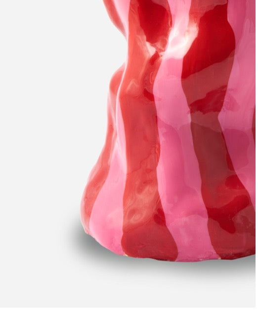 Sculptural ceramic vase by Marla Primrose with an organic, twisted silhouette, hand-painted in glossy red and pink candy stripes.